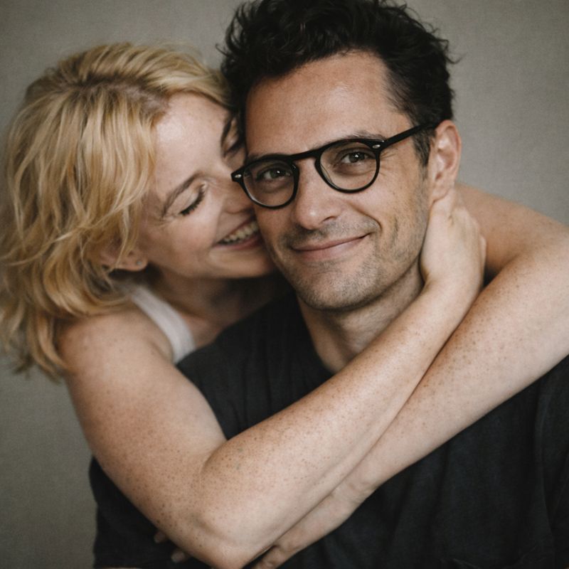 Couple sharing a joyful embrace, representing the genuine connection MyOrbit enables